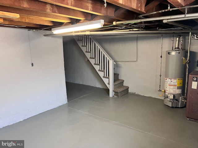 below grade area with gas water heater and stairway