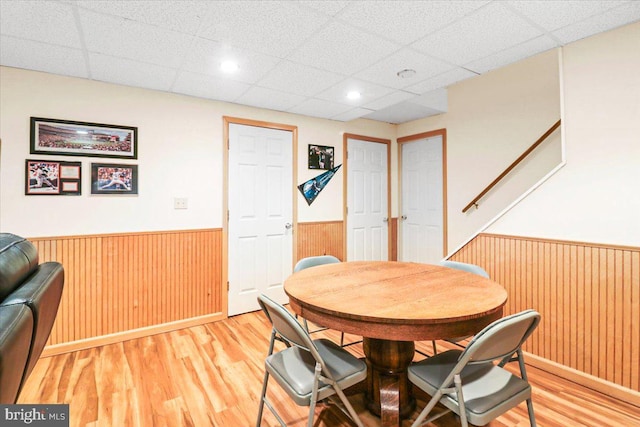 21 Bright Summer Way, Glenmoore, PA 19343 - dining area with wainscoting, wood walls, light wood-type flooring, and a paneled ceiling