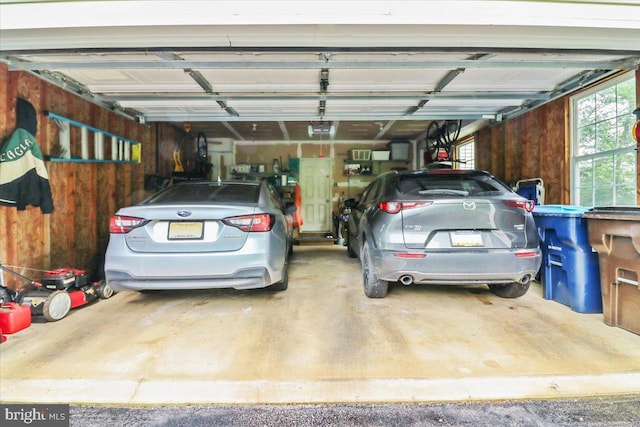 21 Bright Summer Way, Glenmoore, PA 19343 - garage featuring a garage door opener and wood walls