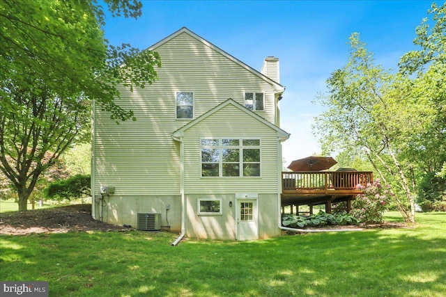 21 Bright Summer Way, Glenmoore, PA 19343 - back of property featuring a chimney, a wooden deck, a yard, and central AC unit