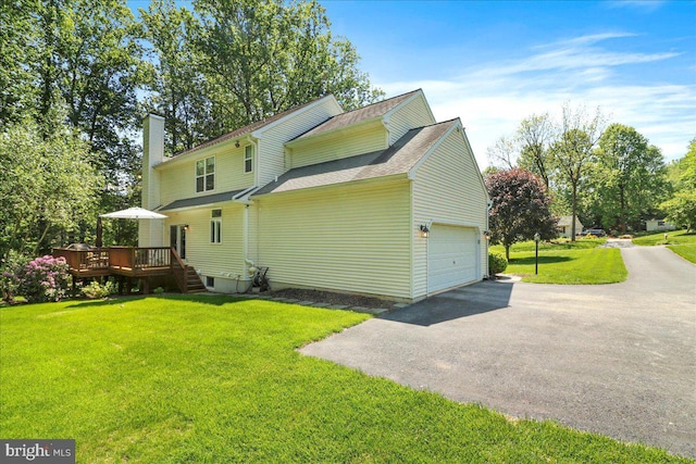 21 Bright Summer Way, Glenmoore, PA 19343 - rear view of house with a deck, a chimney, a garage, a yard, and driveway