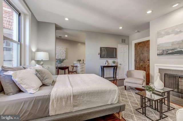 2129 Florida Ave NW Unit 507, Washington, DC 20008 - bedroom featuring recessed lighting and a tile fireplace