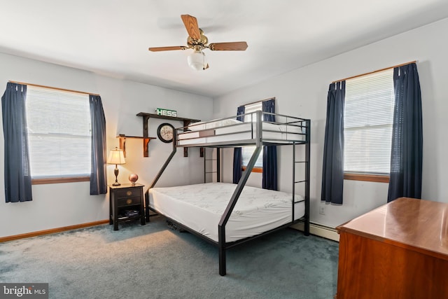 carpeted bedroom featuring multiple windows, baseboards, and a ceiling fan