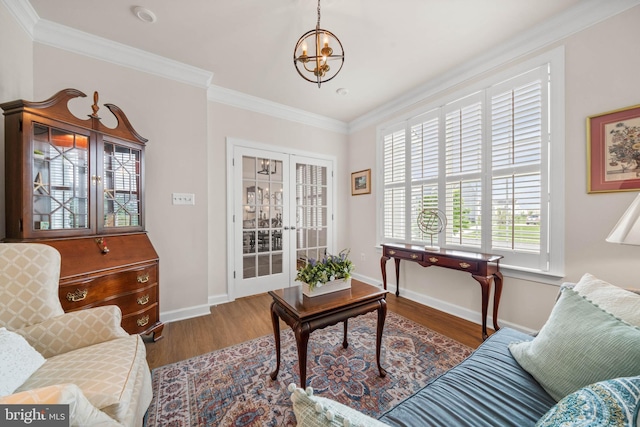 355 Dillon Cir, Middletown, DE 19709 - living area featuring wood finished floors, a chandelier, baseboards, ornamental molding, and french doors