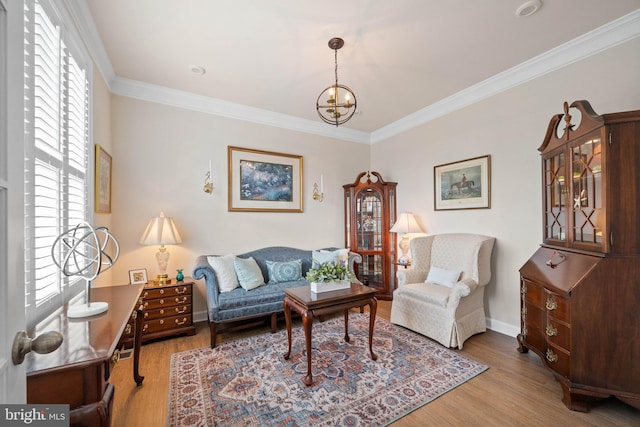 355 Dillon Cir, Middletown, DE 19709 - living room with wood finished floors, ornamental molding, a chandelier, and baseboards