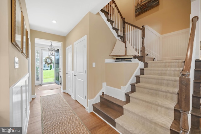 355 Dillon Cir, Middletown, DE 19709 - entryway with stairs, wood finished floors, and a chandelier