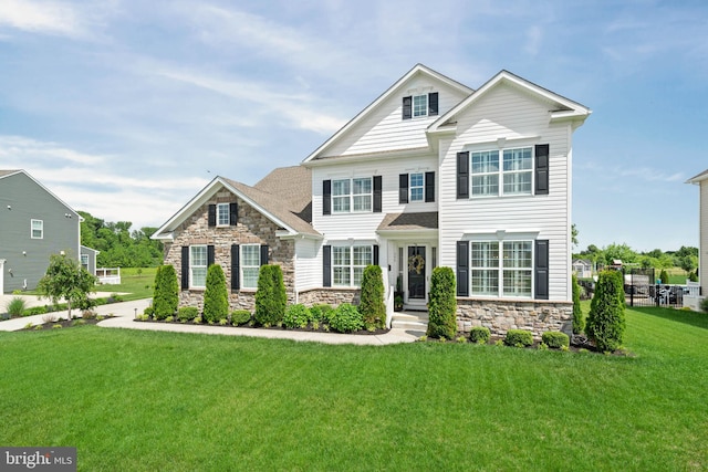 355 Dillon Cir, Middletown, DE 19709 - view of front facade featuring stone siding and a front yard