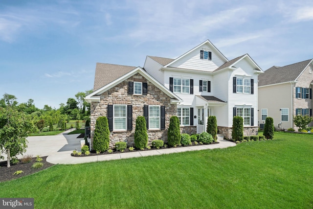 355 Dillon Cir, Middletown, DE 19709 - view of front of house featuring stone siding, a front lawn, and driveway
