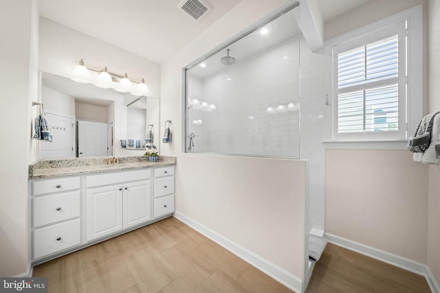 355 Dillon Cir, Middletown, DE 19709 - bathroom with a walk in shower, vanity, and baseboards