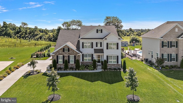 355 Dillon Cir, Middletown, DE 19709 - view of front facade featuring stone siding and a front yard