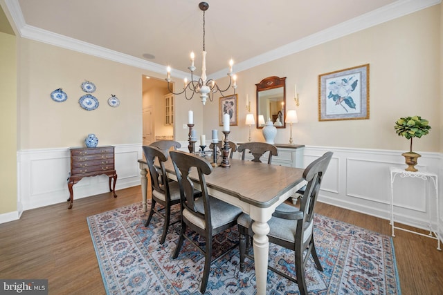 355 Dillon Cir, Middletown, DE 19709 - dining area featuring a chandelier, crown molding, wood finished floors, a wainscoted wall, and a decorative wall