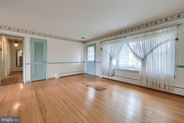 124 Sprecher Rd, Willow Street, PA 17584 - unfurnished room featuring a baseboard heating unit and wood finished floors