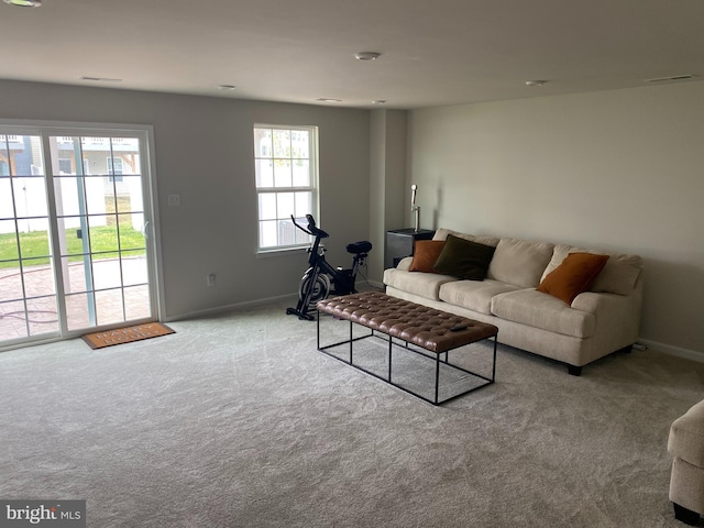 living area with carpet flooring and baseboards