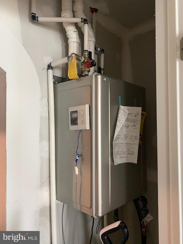 utility room with water heater