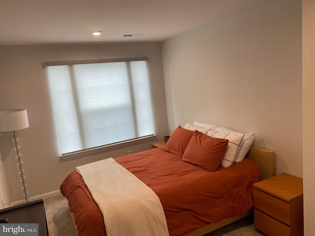 carpeted bedroom with baseboards