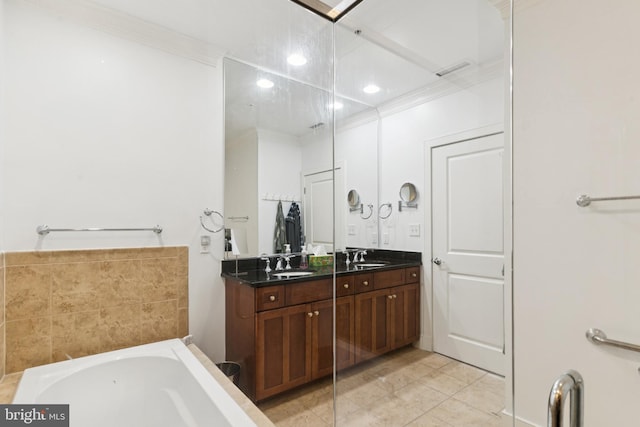 66 Franklin St Unit 307, Annapolis, MD 21401 - bathroom featuring double vanity, a garden tub, recessed lighting, tile patterned flooring, and crown molding
