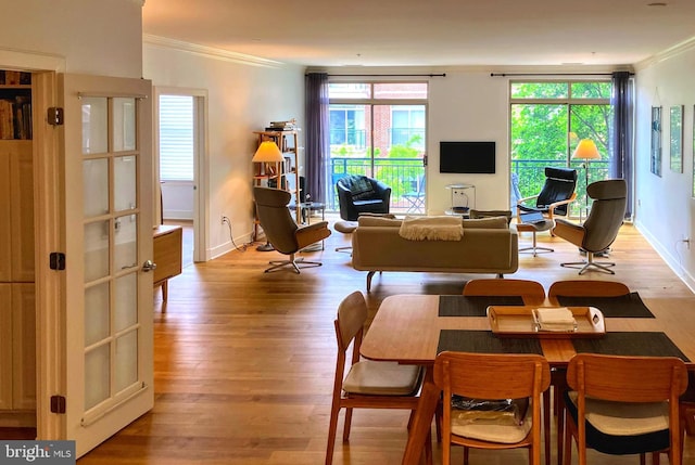 66 Franklin St Unit 307, Annapolis, MD 21401 - living area with ornamental molding, light wood-style floors, and baseboards