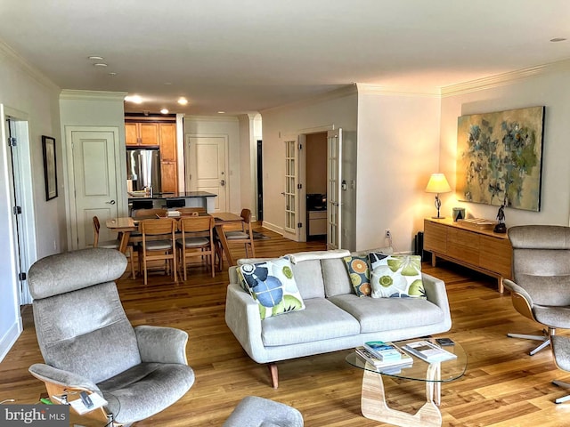 66 Franklin St Unit 307, Annapolis, MD 21401 - living area with crown molding, wood finished floors, recessed lighting, and baseboards