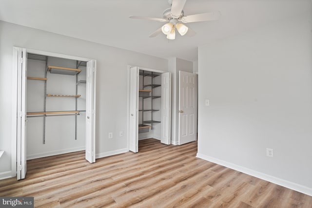3823 9th Rd S, Arlington, VA 22204 - unfurnished bedroom featuring multiple closets, wood finished floors, baseboards, and ceiling fan