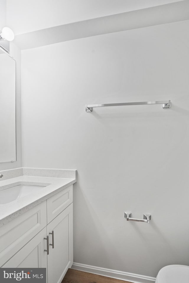 3823 9th Rd S, Arlington, VA 22204 - half bathroom featuring vanity, wood finished floors, and toilet