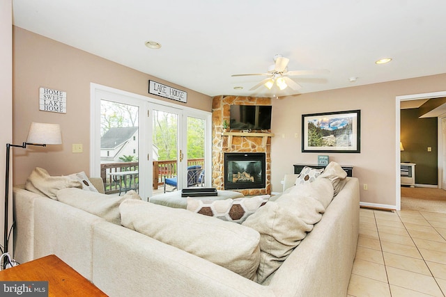 175 Roman Ridge Rd Unit 15, Oakland, MD 21550 - living area with light tile patterned floors, a stone fireplace, ceiling fan, baseboards, and recessed lighting
