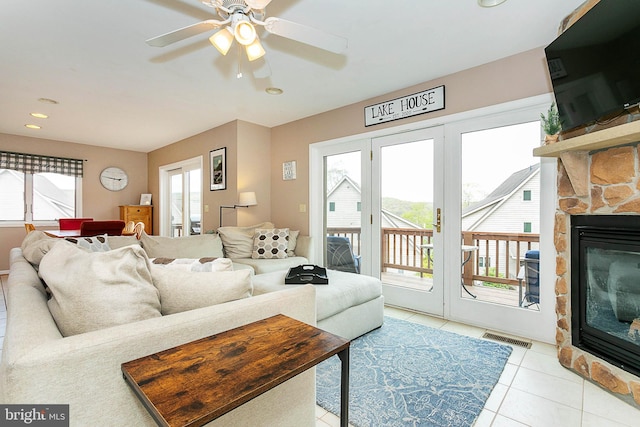 175 Roman Ridge Rd Unit 15, Oakland, MD 21550 - living area featuring healthy amount of natural light, light tile patterned floors, a stone fireplace, ceiling fan, and recessed lighting