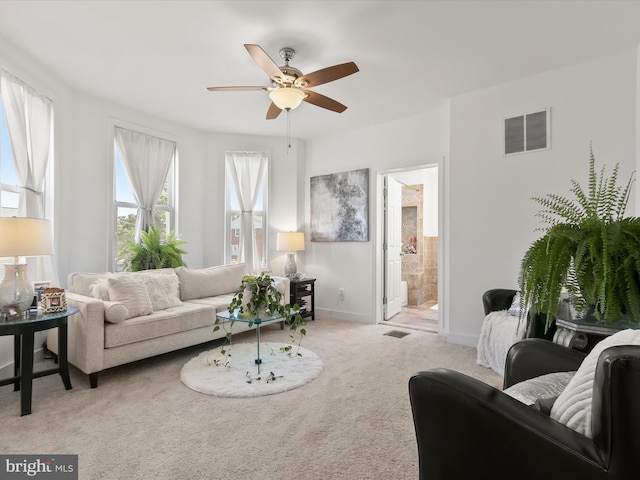 4511 Powell Ave, Baltimore, MD 21206 - living area with a ceiling fan, carpet flooring, and baseboards