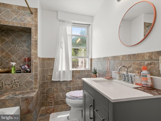 4511 Powell Ave, Baltimore, MD 21206 - full bath with tile walls, wainscoting, toilet, and vanity