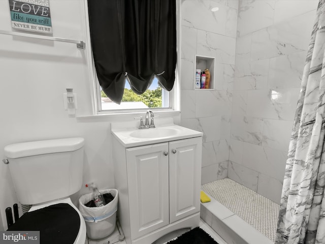 4511 Powell Ave, Baltimore, MD 21206 - bathroom with tiled shower, toilet, and vanity