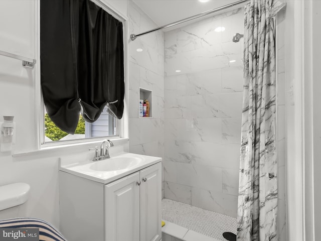 4511 Powell Ave, Baltimore, MD 21206 - full bathroom featuring vanity, a tile shower, and toilet