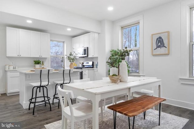 4511 Powell Ave, Baltimore, MD 21206 - dining space with dark wood finished floors, recessed lighting, and baseboards