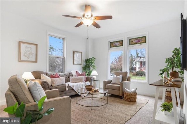 4511 Powell Ave, Baltimore, MD 21206 - living area with ceiling fan and carpet flooring