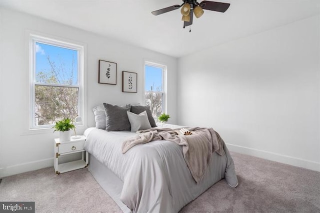 4511 Powell Ave, Baltimore, MD 21206 - carpeted bedroom with multiple windows, baseboards, and ceiling fan