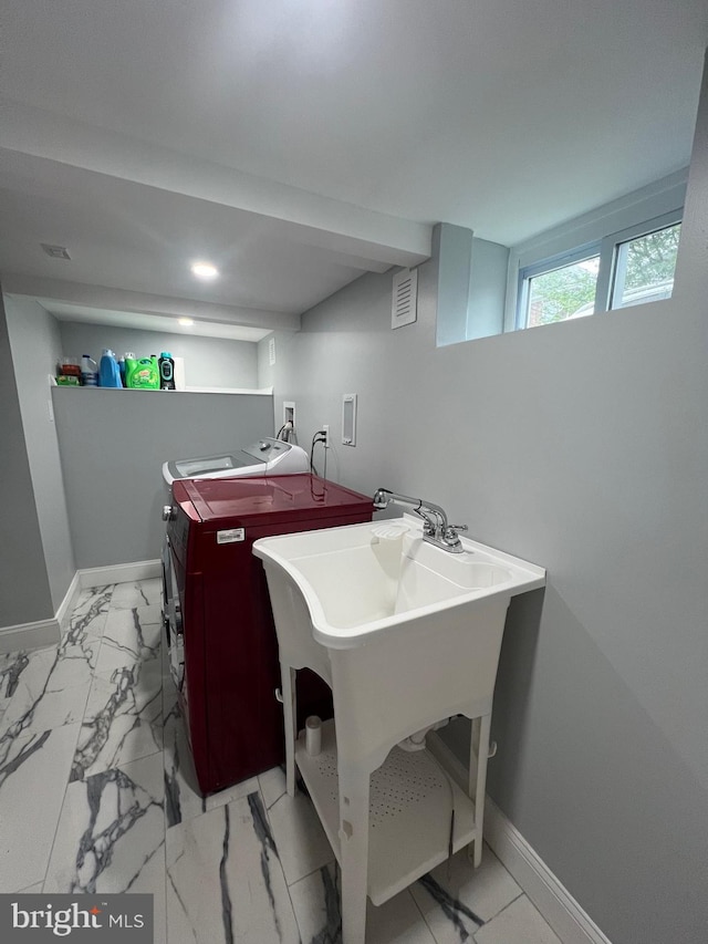 453 Bert Ave, Trenton, NJ 08629 - bathroom featuring baseboards, washer and clothes dryer, and marble look tile flooring
