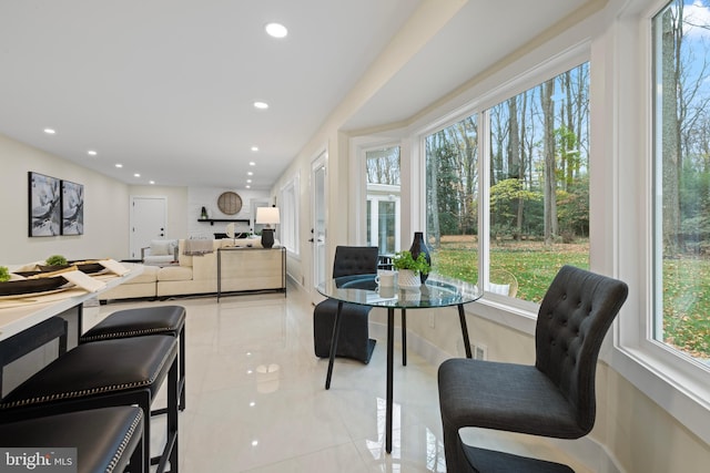 dining space featuring light tile patterned floors, recessed lighting, and french doors