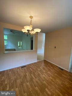 586 Wild Flower Glade, Annapolis, MD 21409 - unfurnished dining area featuring a chandelier, wood finished floors, and a ceiling fan