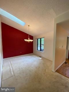 586 Wild Flower Glade, Annapolis, MD 21409 - unfurnished dining area featuring carpet, lofted ceiling, a chandelier, and a skylight