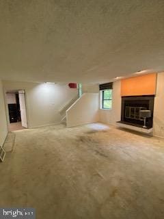 586 Wild Flower Glade, Annapolis, MD 21409 - unfurnished living room with carpet and a glass covered fireplace
