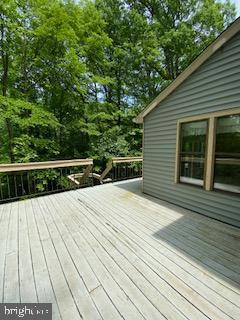 586 Wild Flower Glade, Annapolis, MD 21409 - wooden deck with view of scattered trees