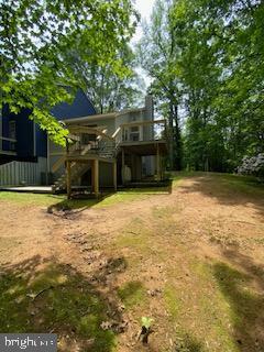 586 Wild Flower Glade, Annapolis, MD 21409 - view of yard with a wooden deck and stairway