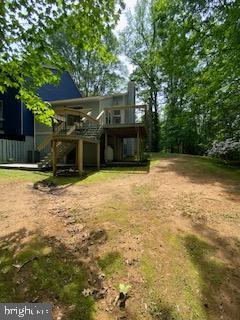 586 Wild Flower Glade, Annapolis, MD 21409 - view of yard featuring a wooden deck and stairs