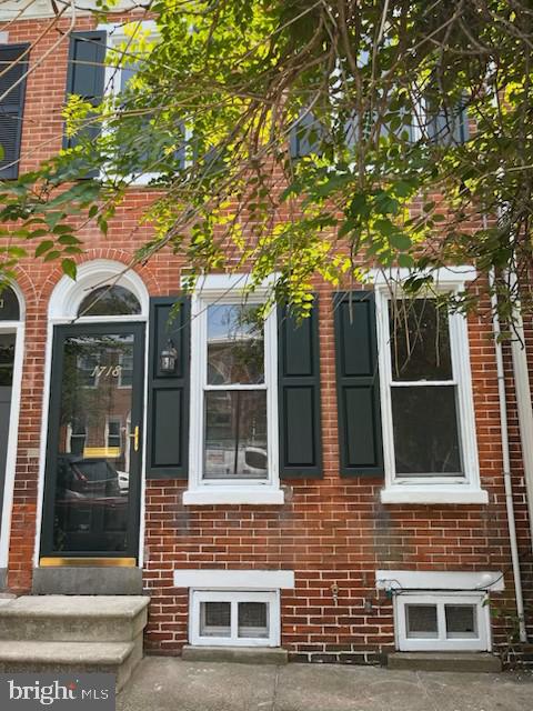 1718 N Scott St, Wilmington, DE 19806 - doorway to property featuring brick siding