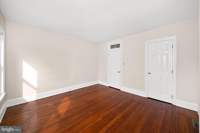1718 N Scott St, Wilmington, DE 19806 - empty room with dark wood-style floors and baseboards