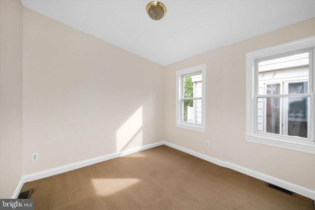 1718 N Scott St, Wilmington, DE 19806 - carpeted spare room with baseboards and lofted ceiling
