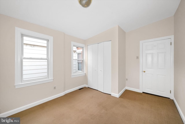 1718 N Scott St, Wilmington, DE 19806 - unfurnished bedroom featuring carpet, baseboards, and a closet