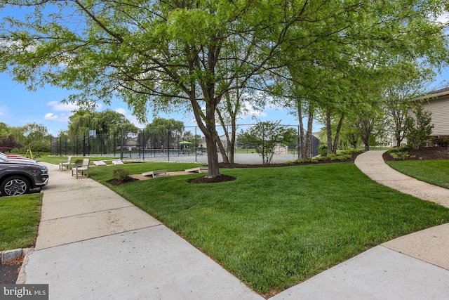 view of yard featuring a tennis court