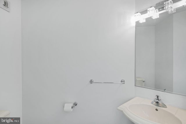 bathroom featuring a sink and toilet