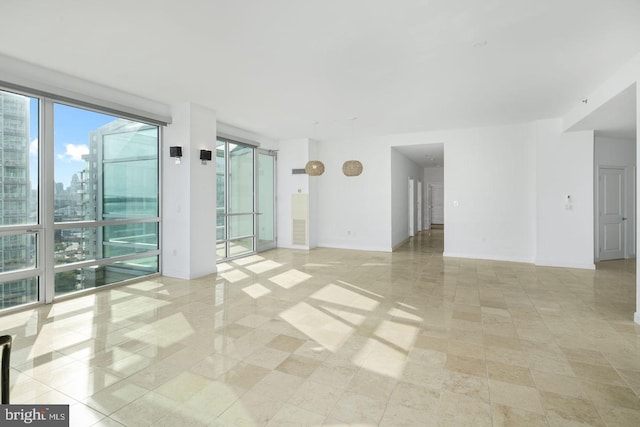 unfurnished room with light tile patterned floors