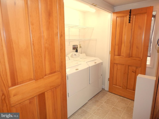 washroom featuring washing machine and clothes dryer