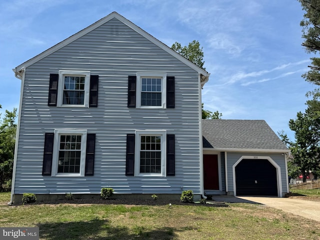 203 Shenandoah Rd, Cinnaminson, NJ 08077 - view of front of home with driveway, a garage, and a front lawn